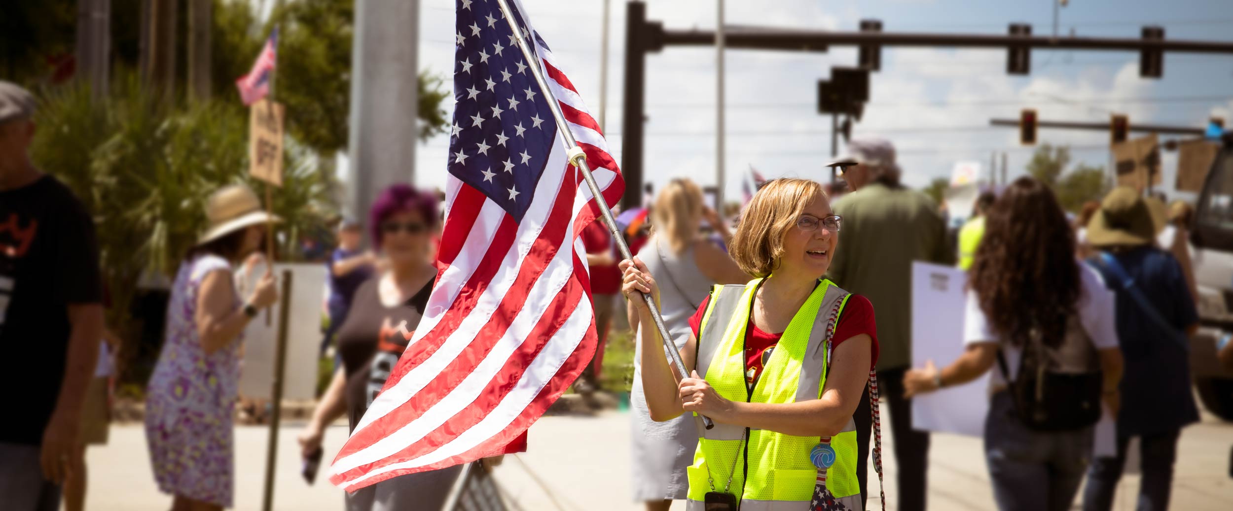 deb-flag Person at a protest holding an American flag